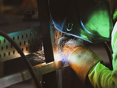 PAVE Manufacturing Welder working on a project