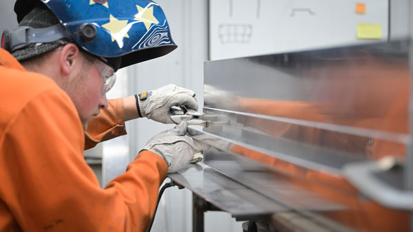 sheet-metal-fab Welder working on sheet metal project