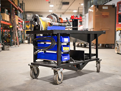 Black cart on wheels with tools